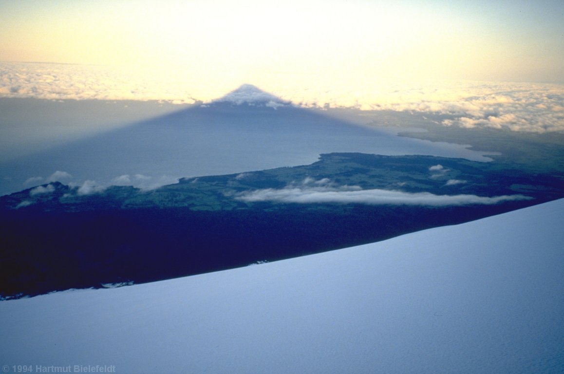 Osorno casts its shadow on the clouds of in plains