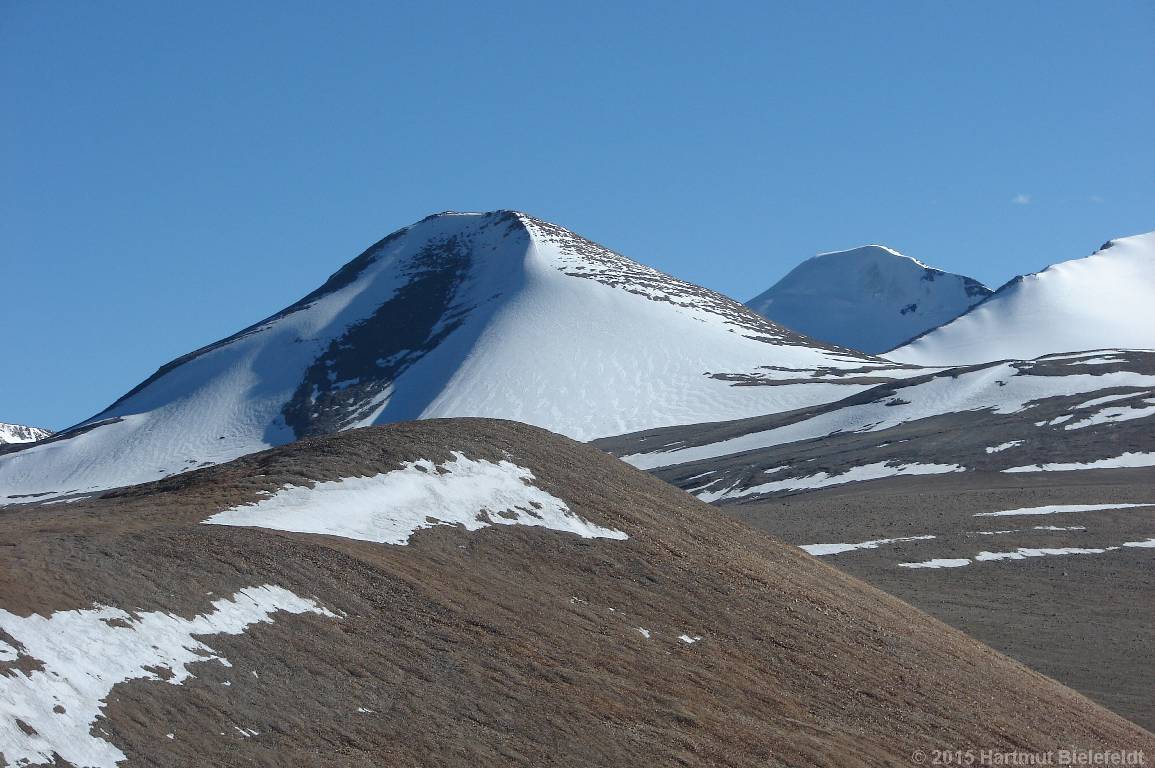 P. 6100 (as we find out later) and the third high summit of the Gyama Peaks